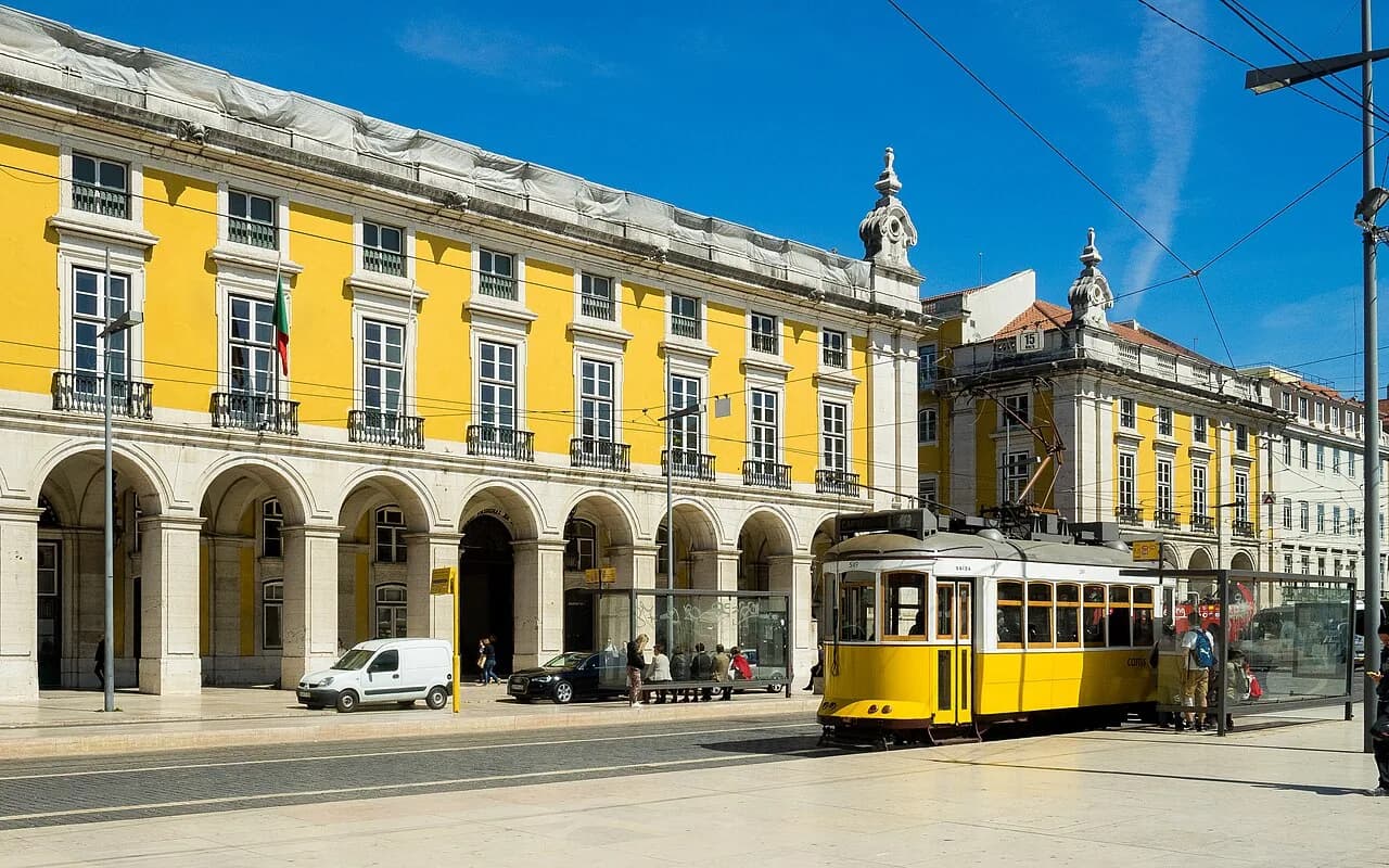 Traditional yellow Lisbon tram at Praça do Comércio